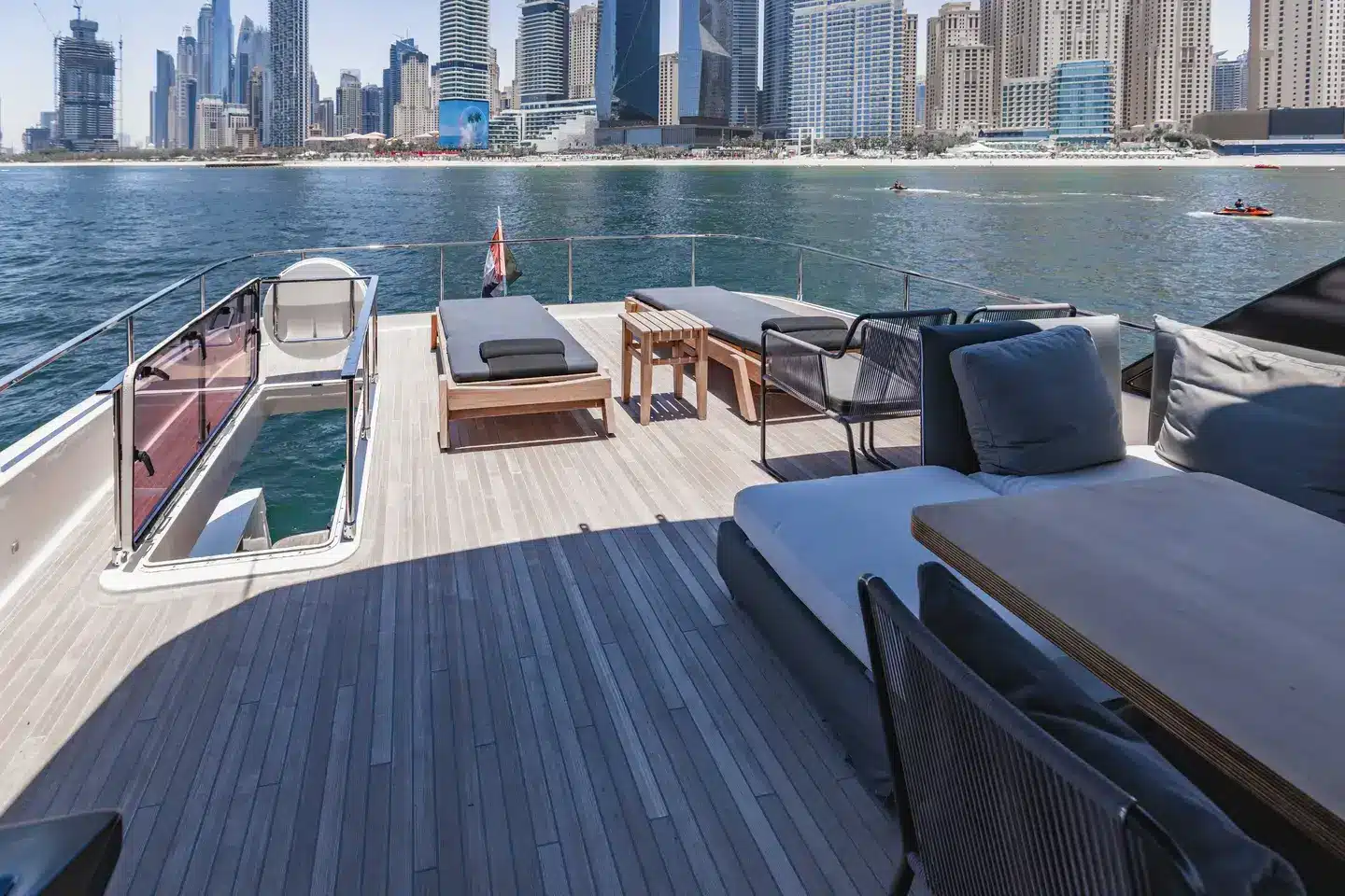 Ferretti 780 flybridge sun loungers overlooking the Dubai Marina skyline