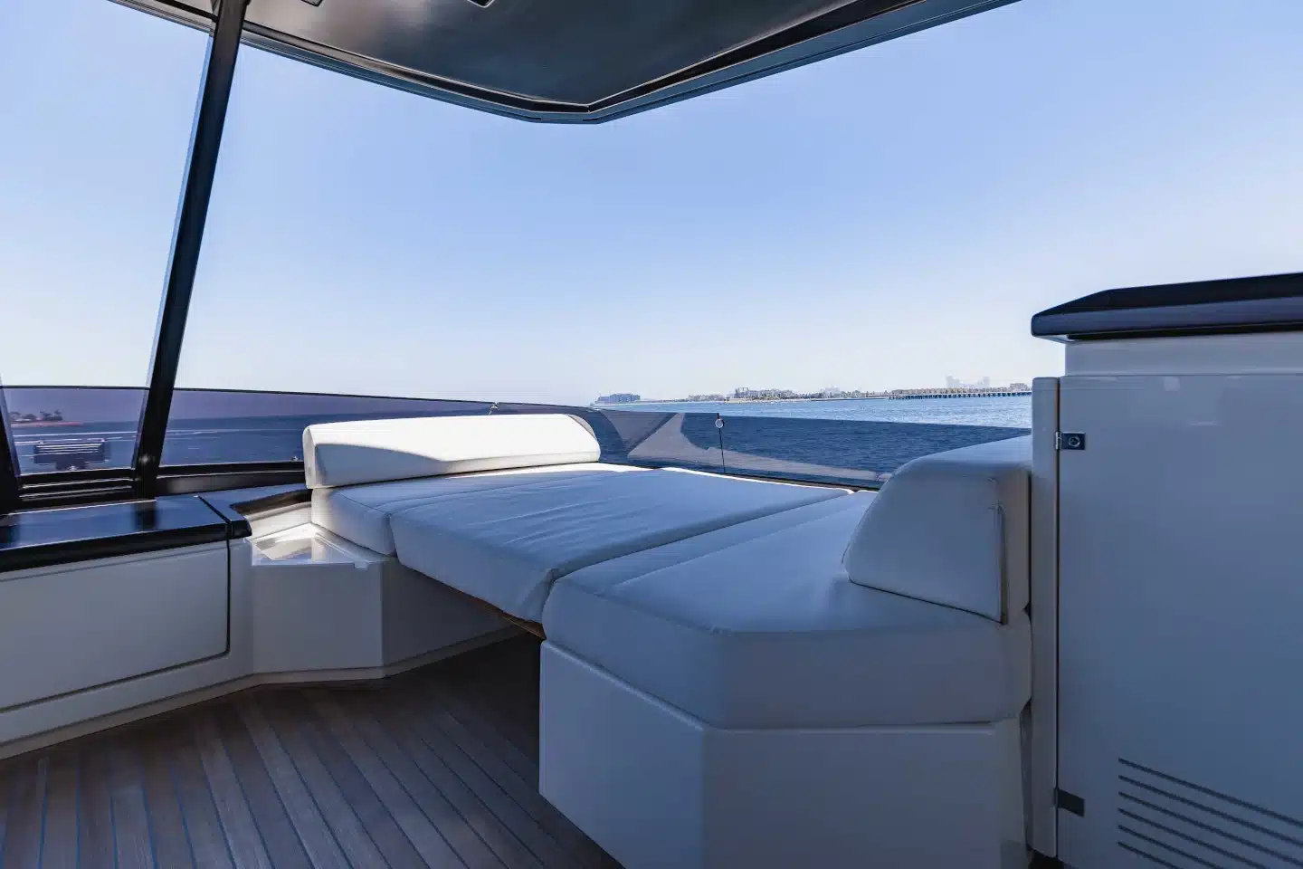 Ferretti 780 foredeck sun pad seen forward from the flybridge
