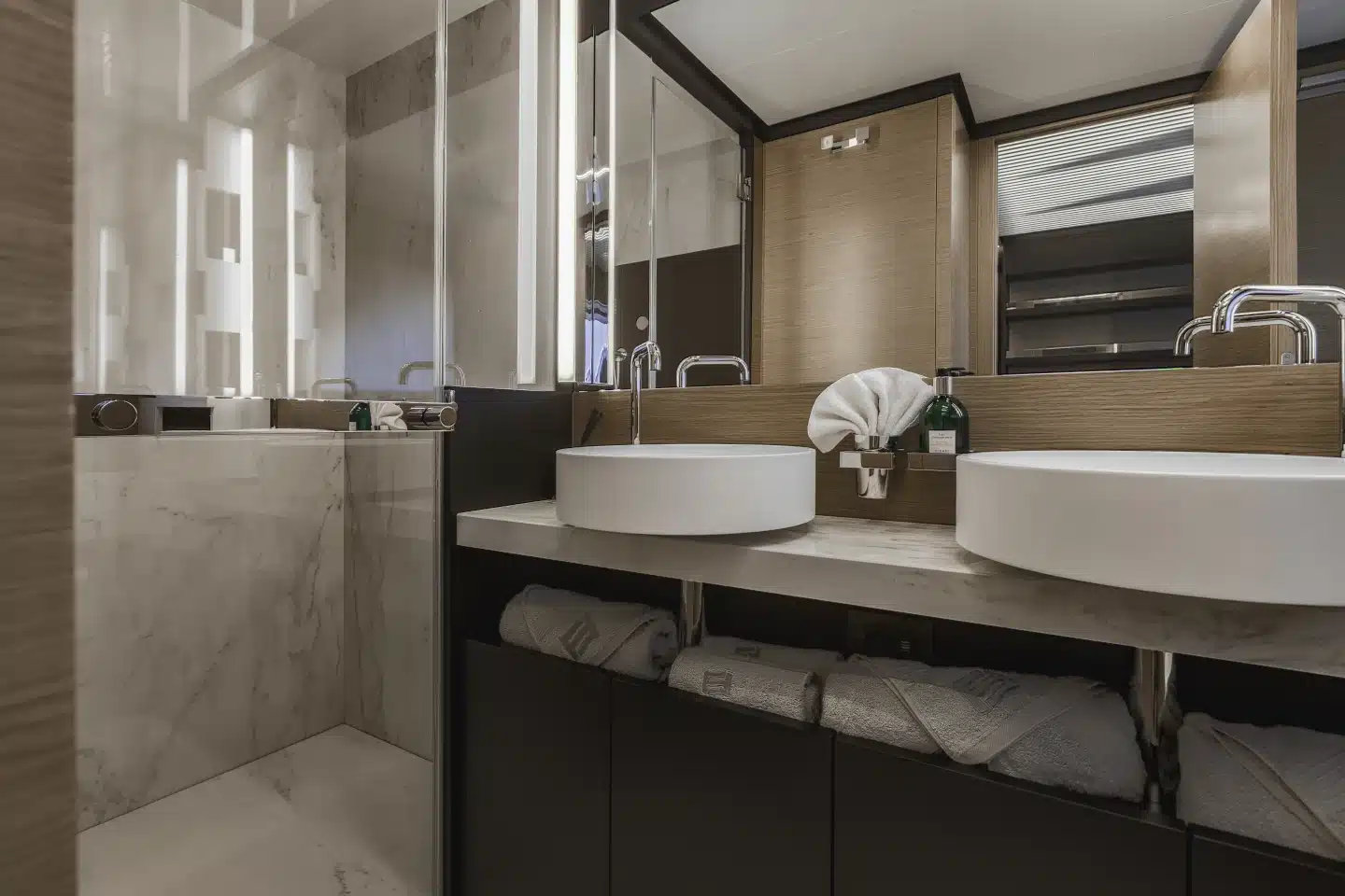 Ferretti 780 ensuite with twin basins, stone surfaces and walk-in shower