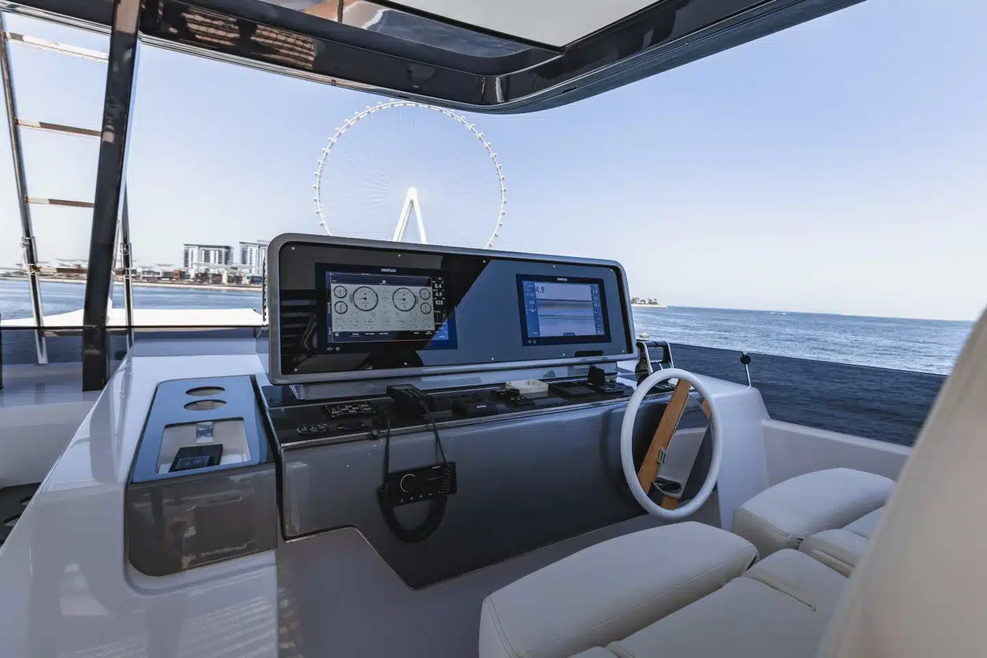 Ferretti 860 flybridge helm station with twin displays and joystick controls
