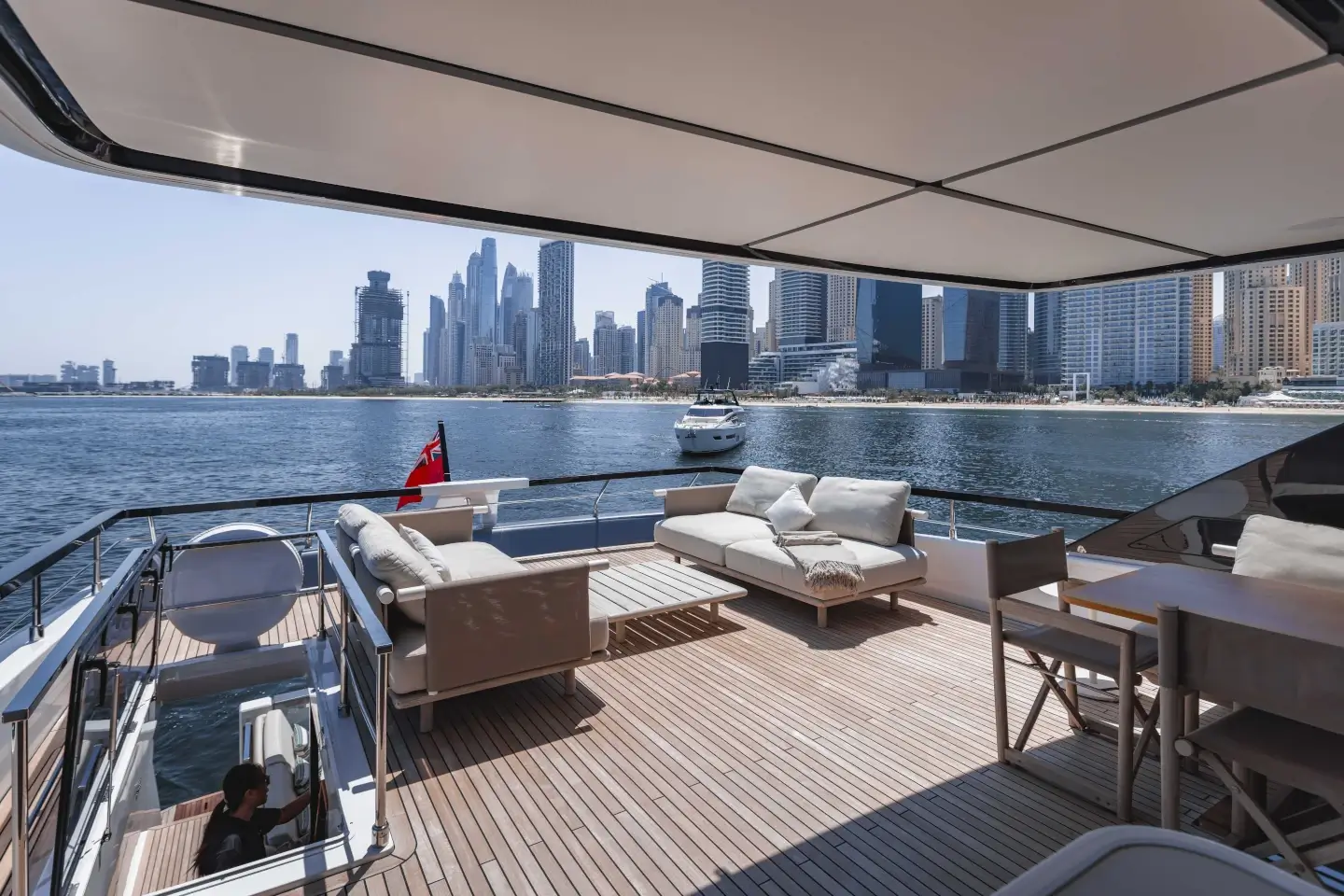 Ferretti 860 flybridge lounge overlooking the Dubai Marina skyline