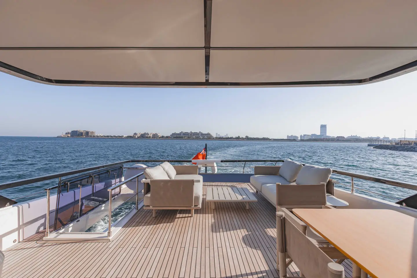 Ferretti 860 flybridge seating and teak deck under the hardtop