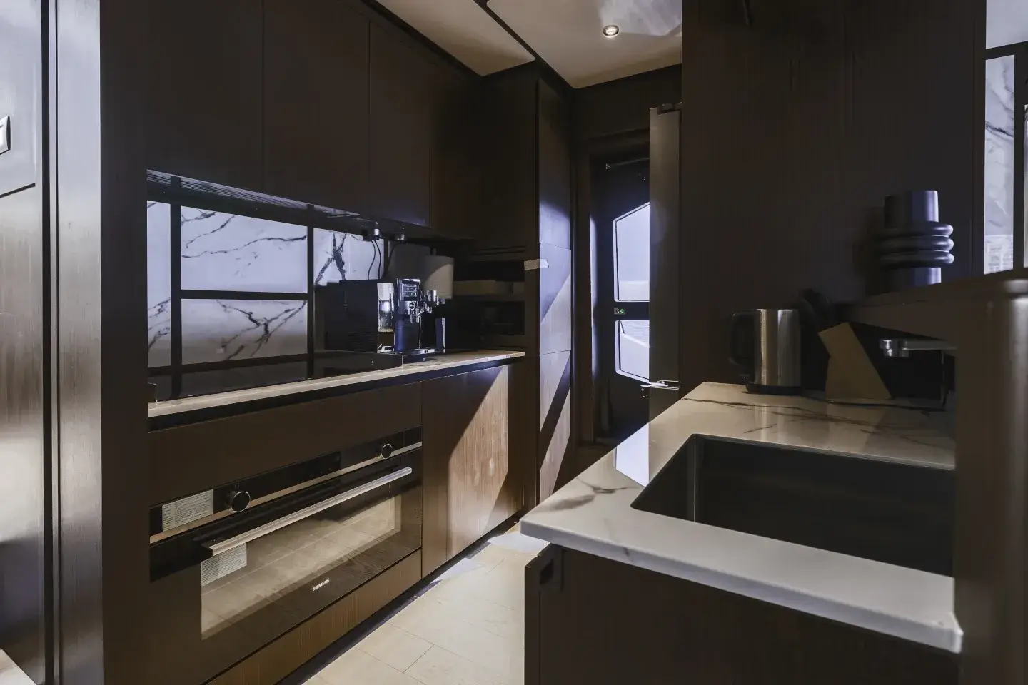Ferretti 860 galley with stone worktops, sink and coffee machine