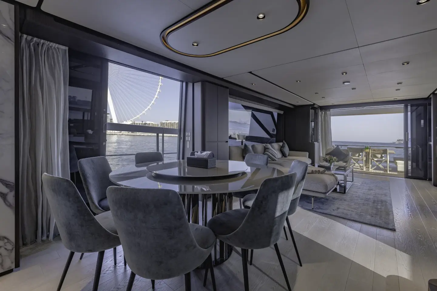 Ferretti 860 interior dining table for six with Ain Dubai through the window