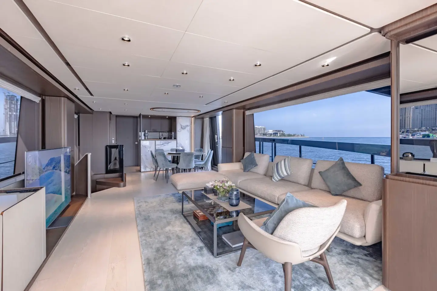 Ferretti 860 main saloon with full-height windows and lounge seating