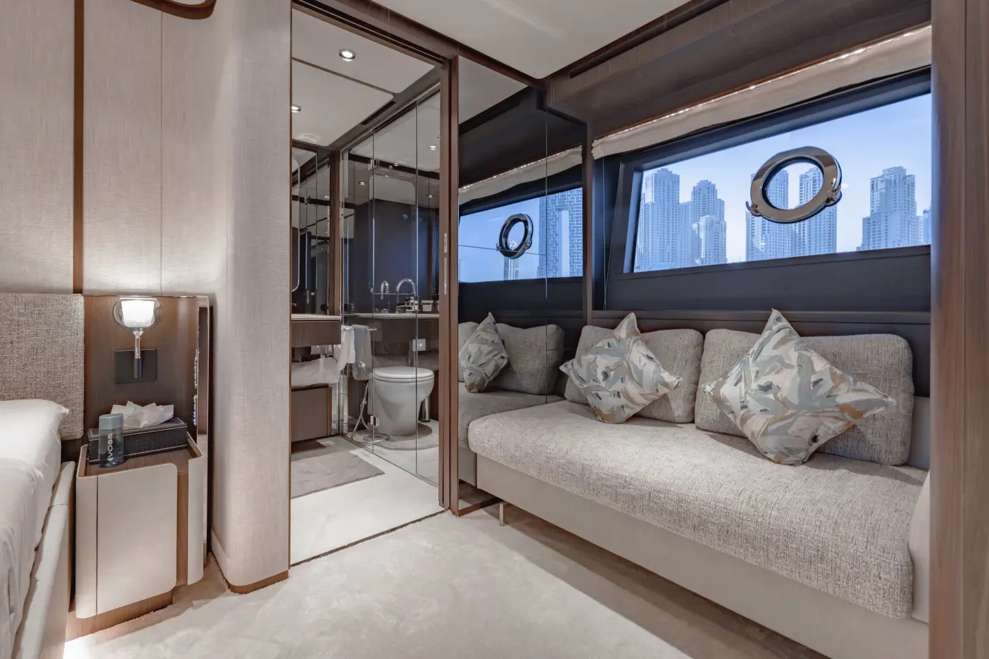 Ferretti 860 master cabin seating area with sofa and vanity