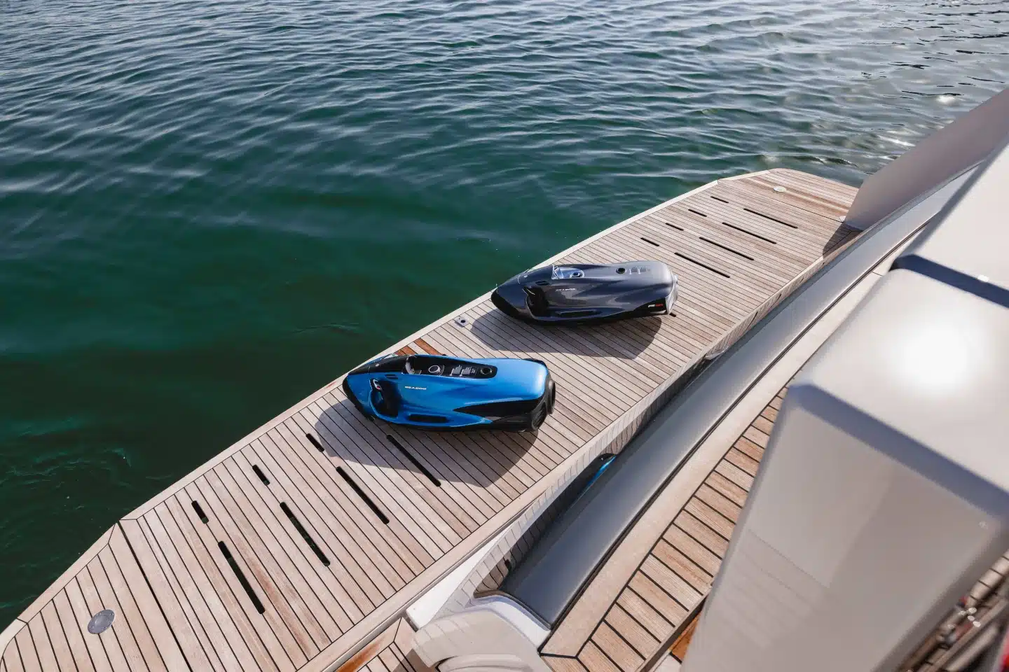 Seabobs stowed on the Ferretti 860 teak swim platform
