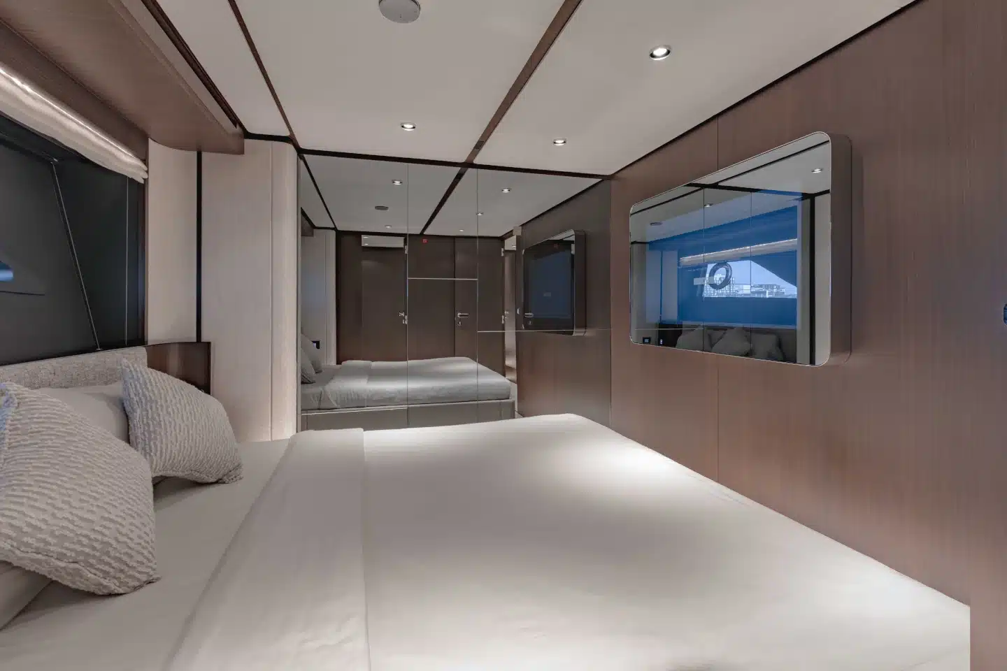Ferretti 860 VIP cabin with double berth and wall-mounted television