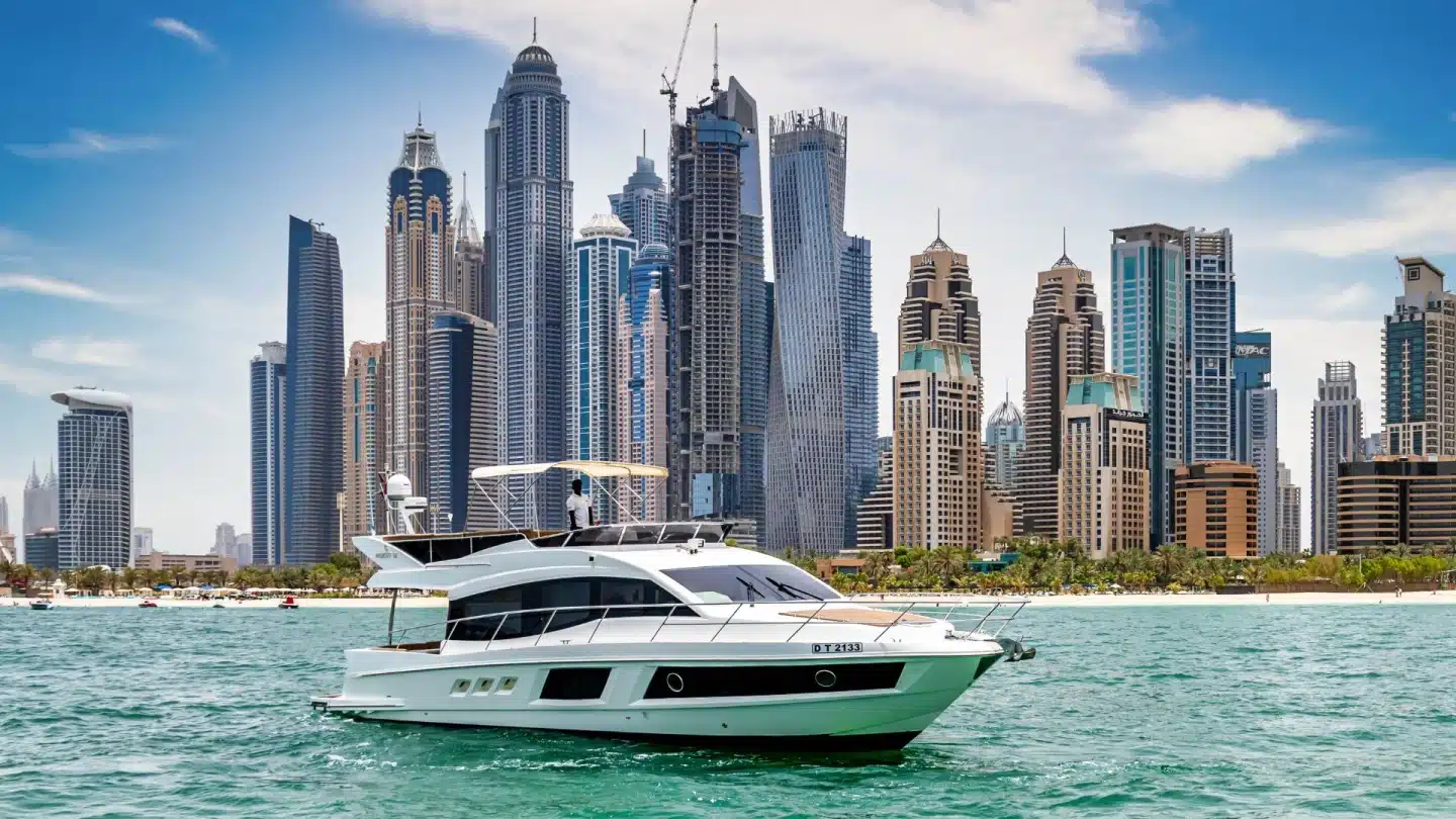 Anna 50 yacht cruising past Dubai Marina skyline