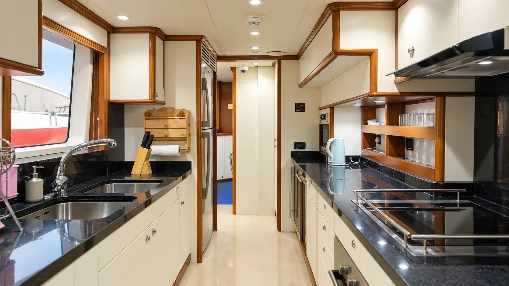 Benetti 120 yacht galley with black countertops