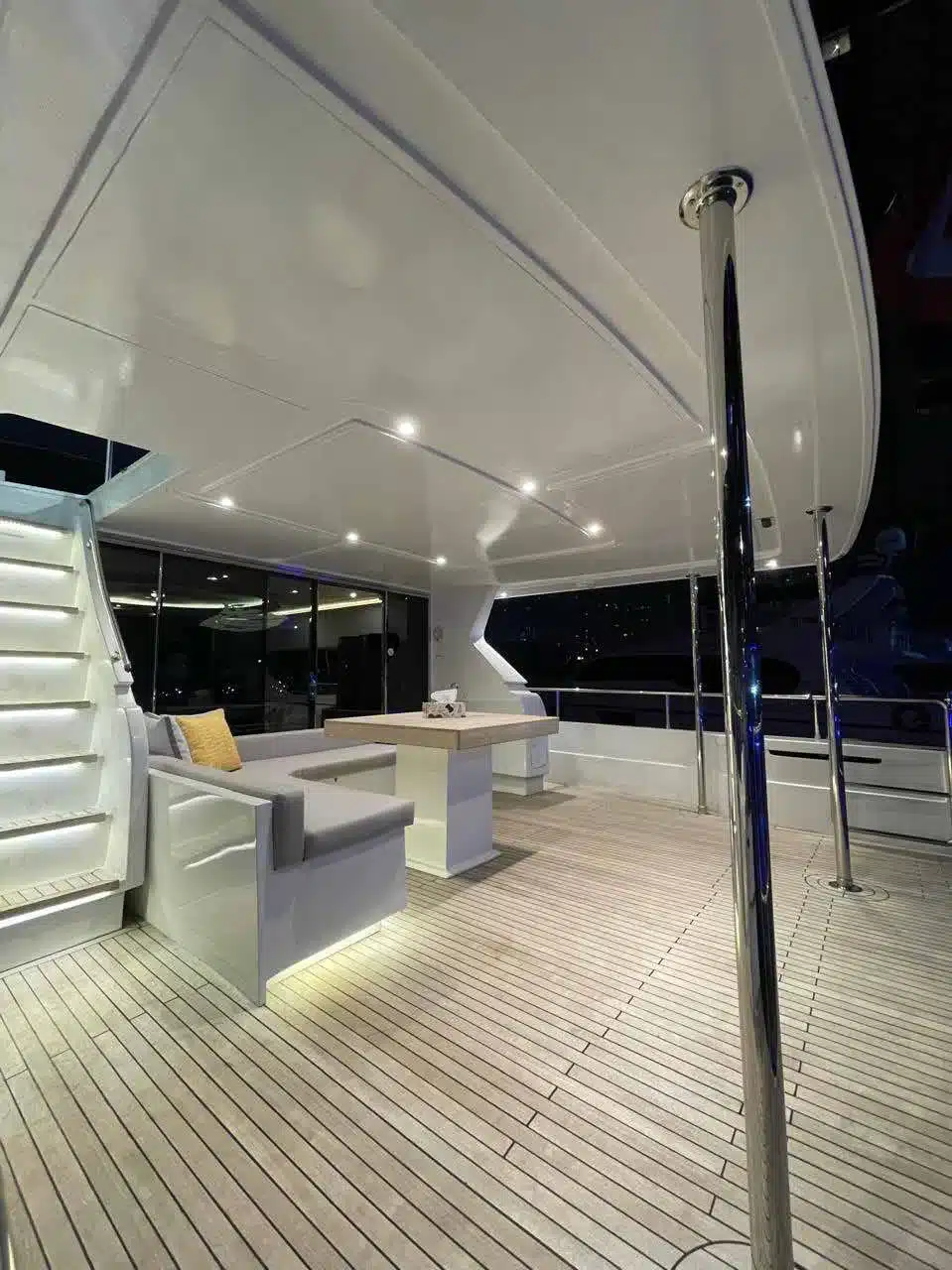 Vivir yacht deck lit up at night in Dubai Marina