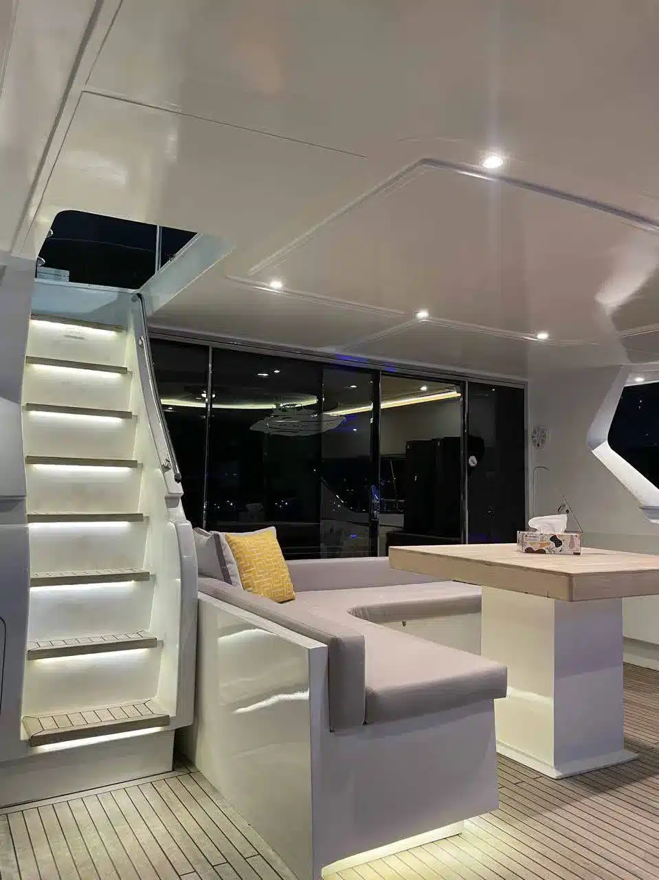 Vivir yacht deck lit up at night in Dubai Marina