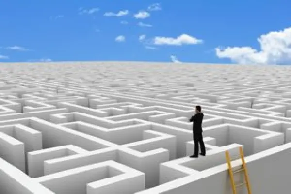man standing on top of maze to symbolize steps to take to prepare for divorce