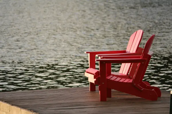 beach chairs by lake symbolizing retirement and collection of social security benefits