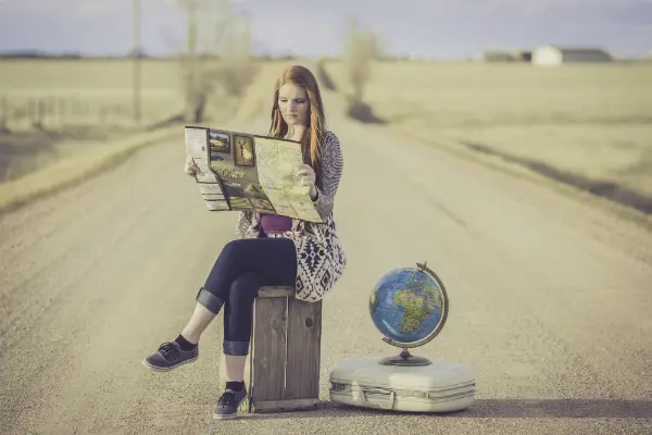 woman reading map to symbolize where to modify alimony when neither party lives in state initiating order