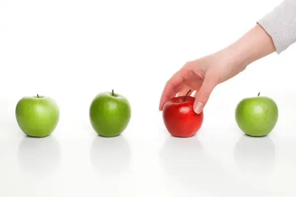 Person picking apple symbolizing choosing a divorce lawyer