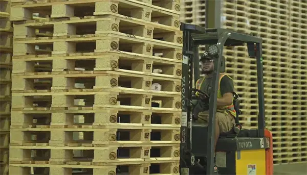 forklift operator moving EPAL pallets for shipping internationally