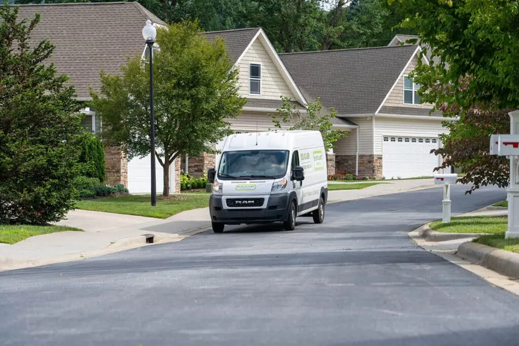 Blue Planet Home Services truck in neighborhood