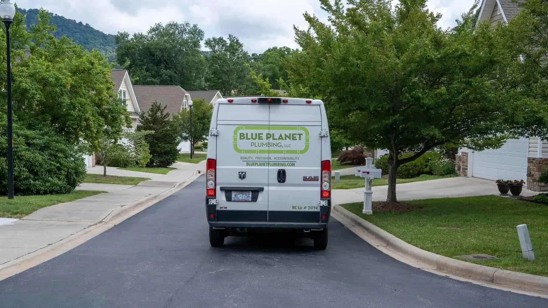 Blue Planet Home Services van driving through neighborhood