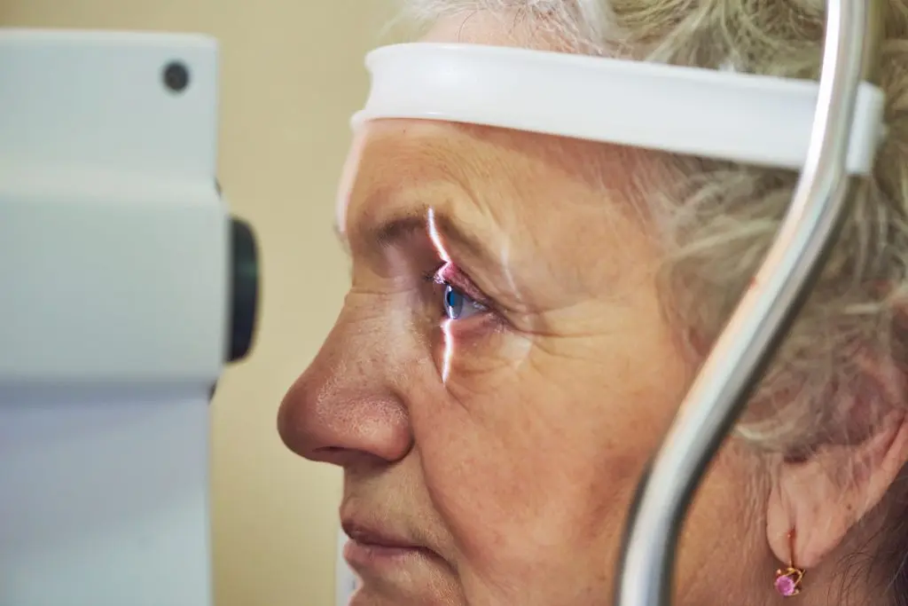 eyesight check of adult female woman