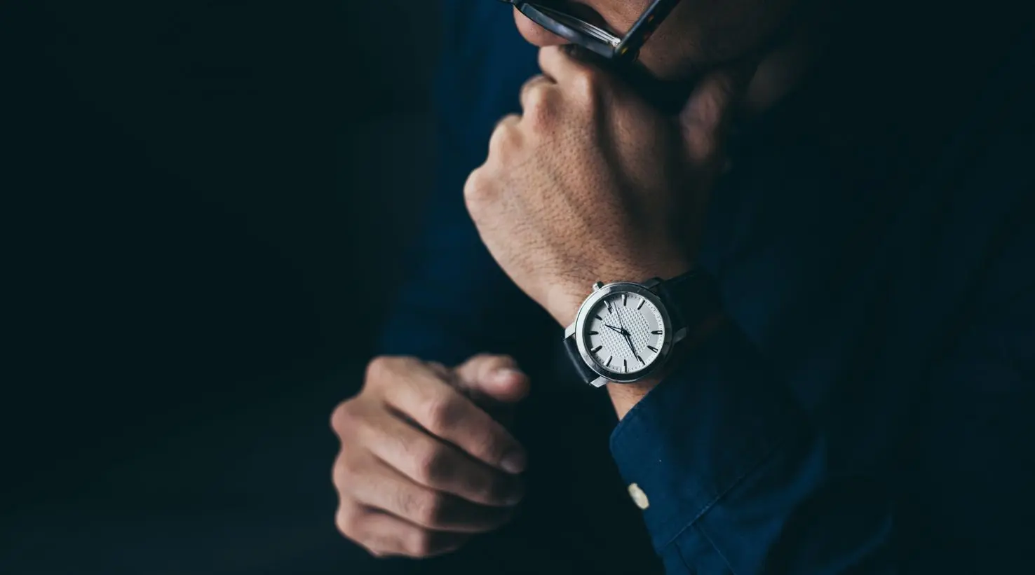 looking at luxury watch on hand ARRIVING ON TIME