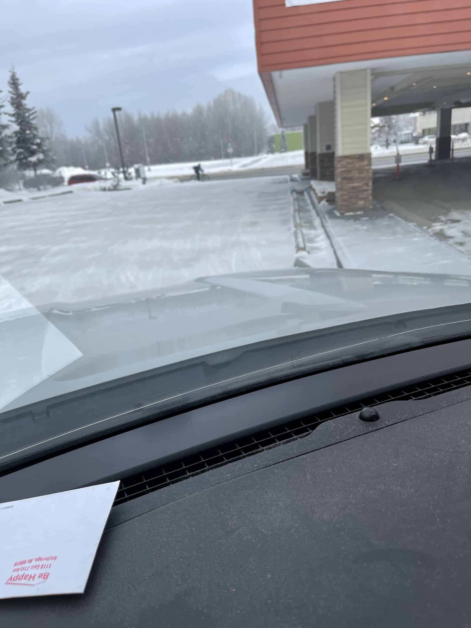 Plowed parking lot outside Be Happy Property Services