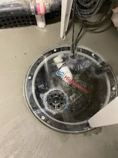 Sump pit with Highlander Waterproofing pump and drainage system.