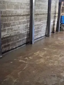 Water-damaged retaining wall and foundation, Highlander Waterproofing solutions.