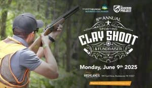 Person aiming a shotgun at a sporting clay, promoting the 8th Annual Sporting Clay Shoot & Fundraiser on June 9th, 2025, hosted by the Pittsburgh Business Exchange and The Asservo Project, supporting community initiatives.