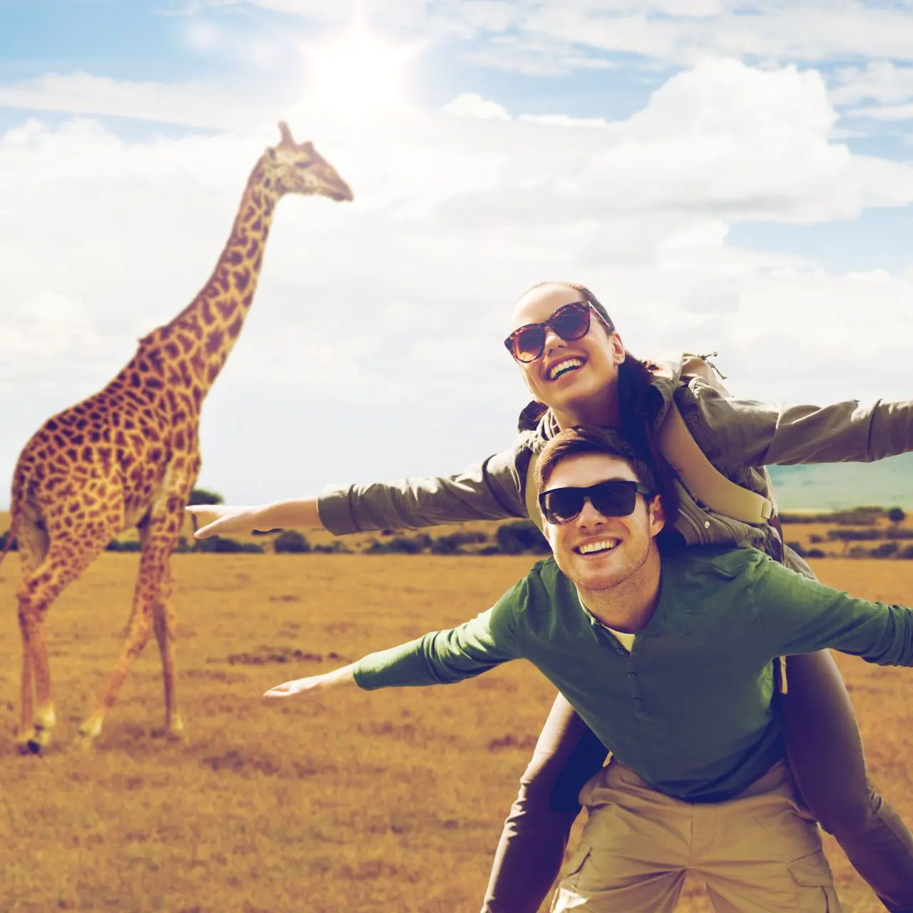 people on a safari and giraffe