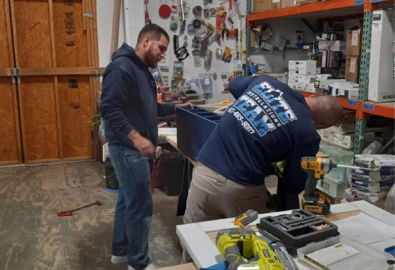a couple of men working in a workshop
