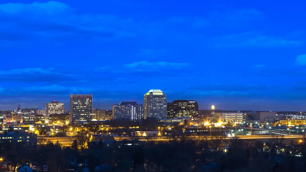 Post-COVID talk on Commercial Real Estate in Colorado Springs picture of commercial real estate in colorado springs with downtown lights and night sky