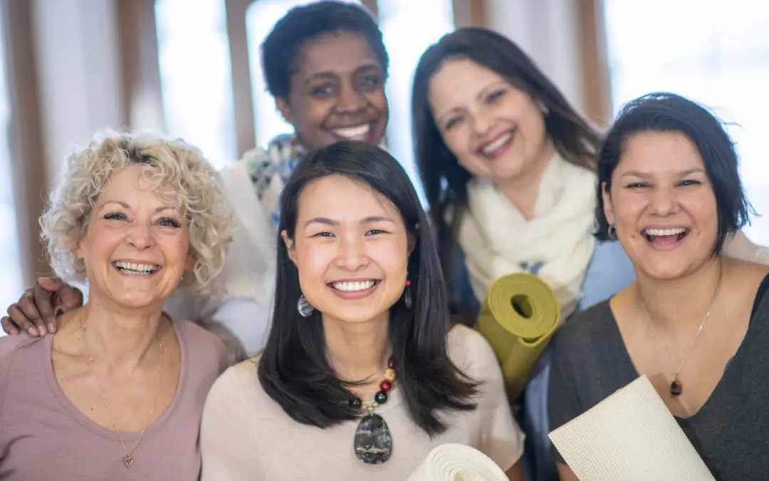 group of diverse women smiling at camera