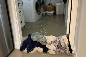Washer flooded laundry room first steps in Louisville KY