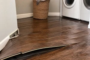 Washing machine overflow damage to flooring in Louisville KY