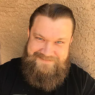 Bearded tattoo artist portrait at Dandyland Custom Tattoo San Antonio