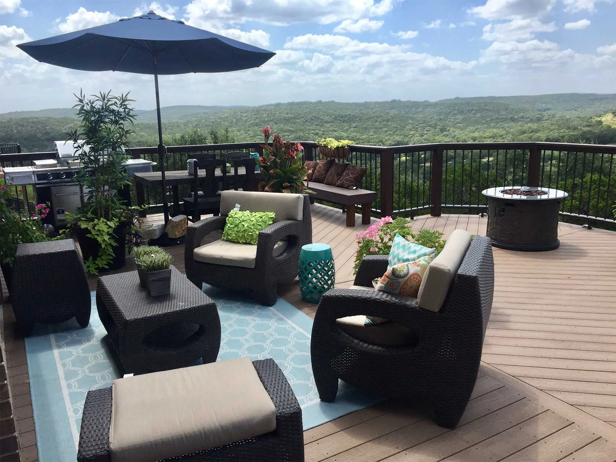 Composite deck with outdoor seating, fire pit and Texas Hill Country views by Diamond Decks