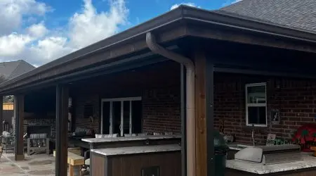 Attached patio cover over an outdoor kitchen by Diamond Decks, San Antonio, TX