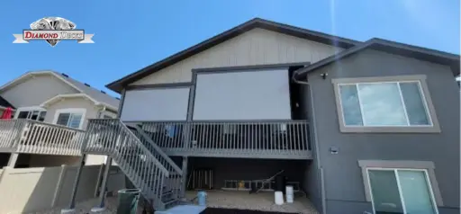 Motorized patio sun shade by Diamond Decks