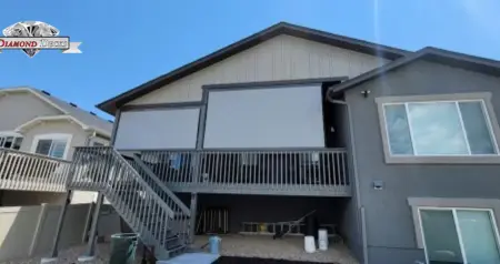 Motorized patio sun shade by Diamond Decks