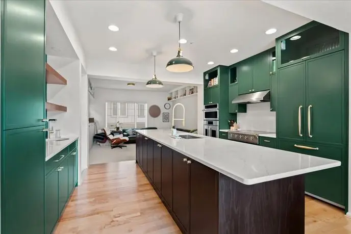 Redmond kitchen remodel with green cabinetry, dark wood island and white quartz countertop