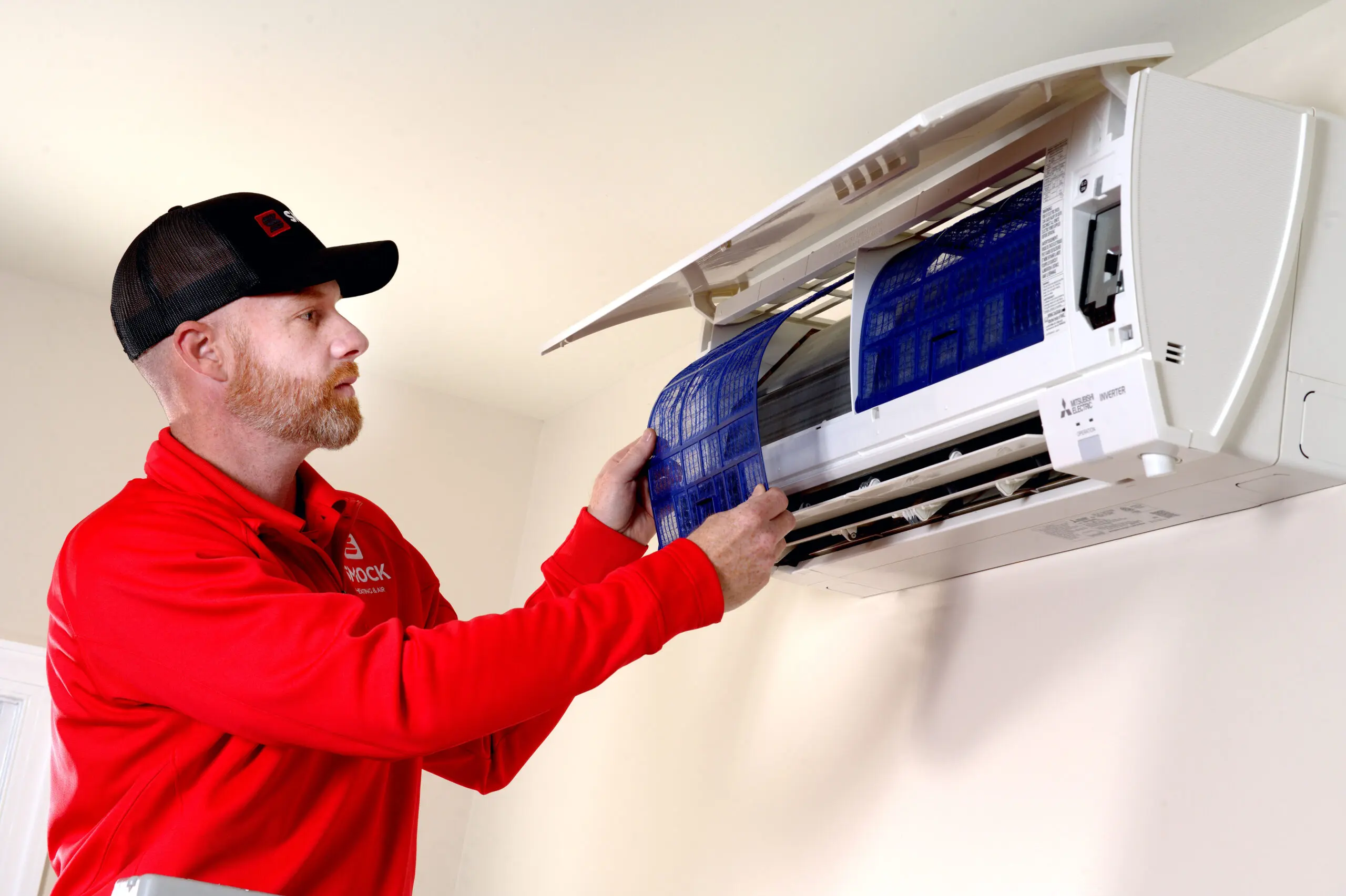 smock worker checking ac unit frederick county