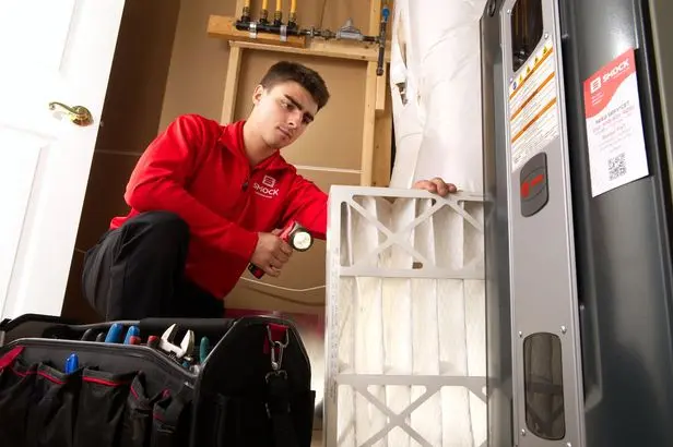 smock worker replacing filter mt airy md