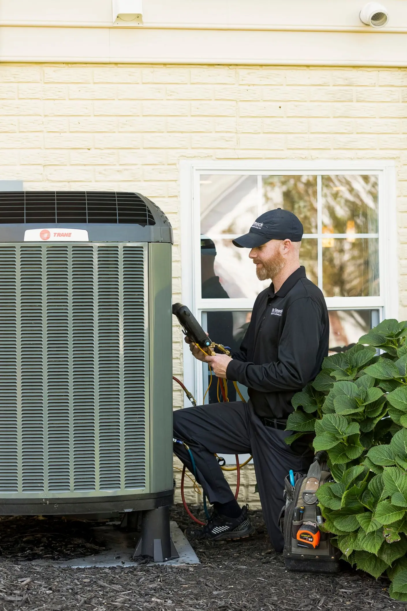 smock worker looking at hvac unit walkersville md