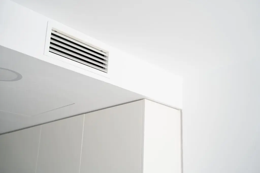 Bright modern apartment interior featuring a ceiling air ventilation