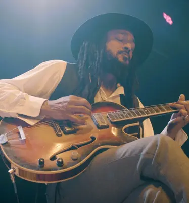 Blues artist playing guitar
