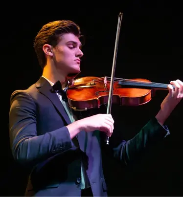 Young violinist performing
