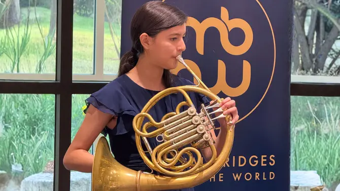 4 MBAW Youth Ambassadors group photo with various instruments