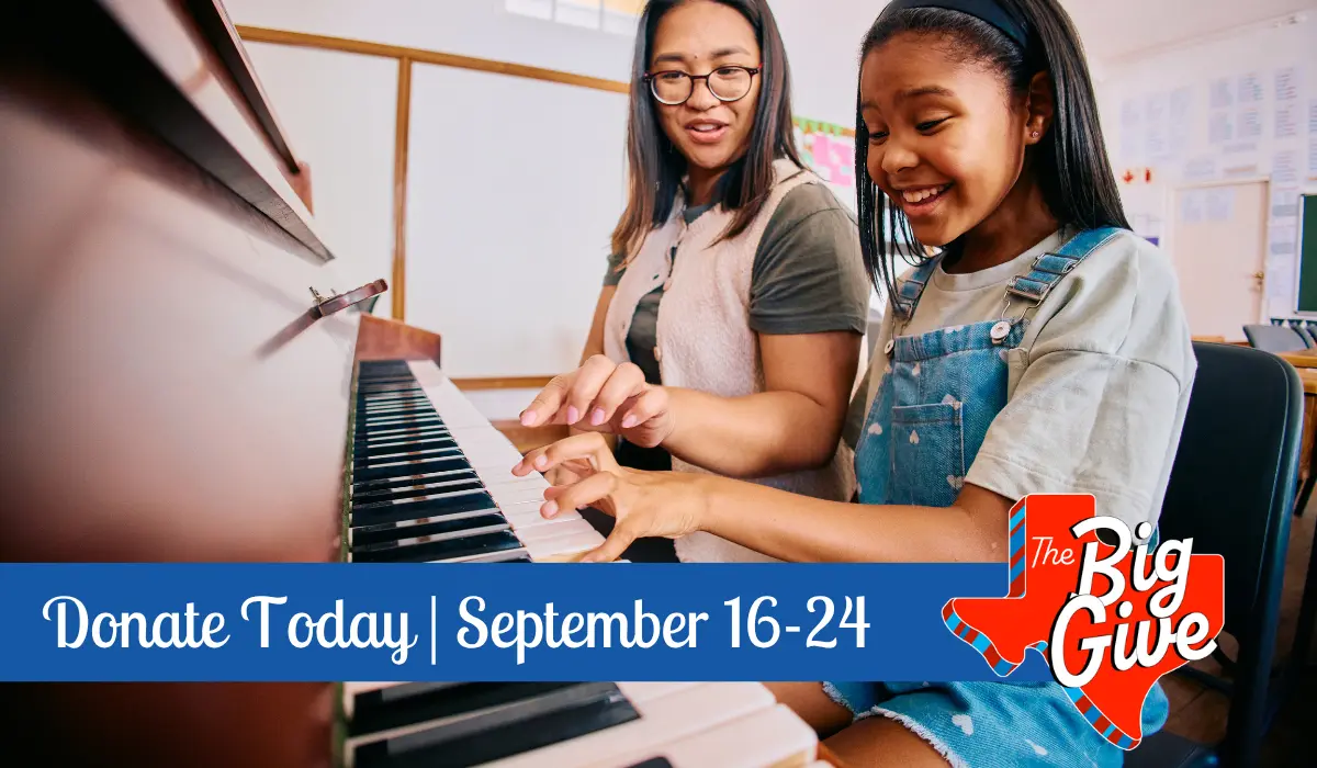 Piano teacher teaching a young girl how to play the piano