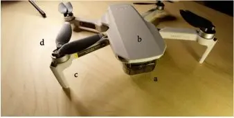 A small white drone